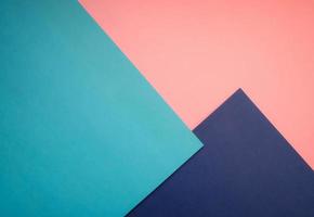 Geometry background minimalist concept, abstract flat lay top view, multicolored empty image with copy space for any design purposes, colored paper dark blue, light blue, bright pink photo