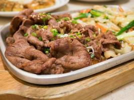 Beef with vegetables on hot plate photo