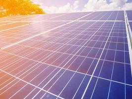 Solar panels with blue sky and clouds photo