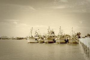 head fishing boat in the river,sepia tone photo