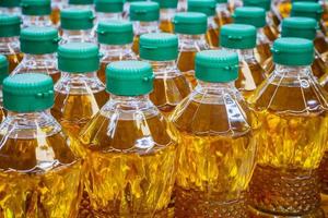 Cooking oil bottles at factory warehouse photo