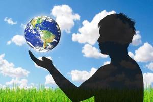 Love the earth and protect the environment concept. Earth day. Earth in people's hands. photo