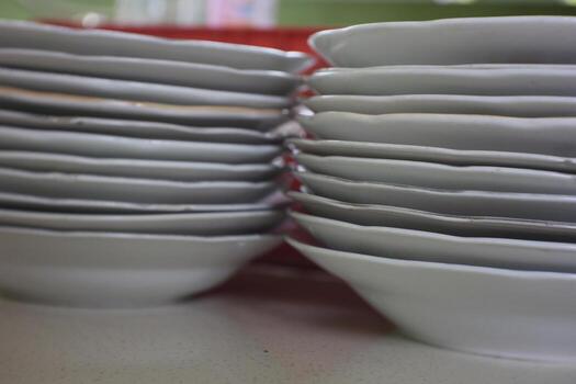 a pile of plates that are neatly arranged and attractive photo