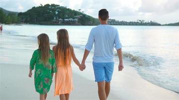 Father and kids enjoying beach summer vacation video