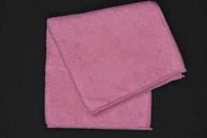A red cloth for wiping. A terry towel. A rag for cleaning the premises. photo
