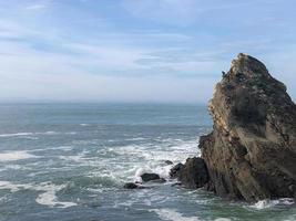 Landscape of a rock in the sea in the bay of the city of Biarritz in France. photo