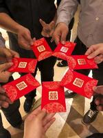 Photo of people gather wedding gift envelope at chinese wedding for their friends and family.