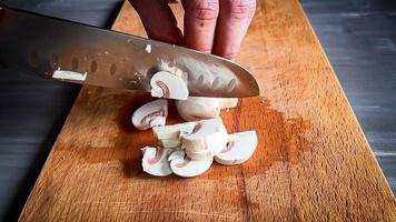 mushrooms on a wooden board. mushrooms on a cutting board. photo