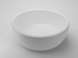 Empty white bowl on white background photo