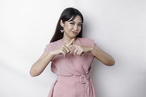 Beautiful Asian woman wearing pink blouse with hand gesture pose rejection or prohibition with copy space photo