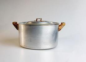 An old aluminum pan made in circa 1960 against a white background. photo