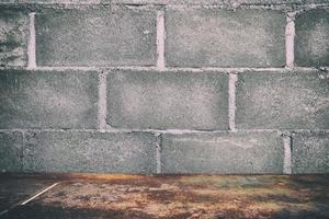 Red Rustic Table with Brick Wall Texture Background, Suitable for Product Presentation Backdrop, Display, and Mock up. photo