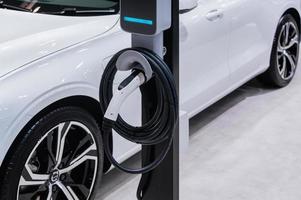 Electric car charging with station, EV fuel advance an modern eco system. photo