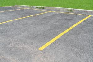 yellow lines parking on asphalt background photo