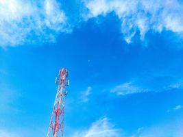 low angle photo of signal transmitter tower with beautiful blue sky view