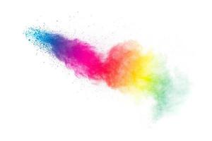 Pastel color dust particles splash.Colorful powder explosion on white background. photo