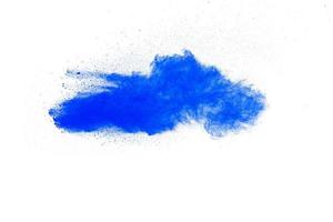 Blue color dust particles explosion cloud on white background.Color powder splash. photo