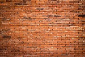 red brick wall and rough crack background texture photo