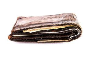 old leather pocket money on isolated white background photo