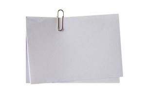 blank white note and clip on isolated photo