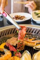 Food on Korean BBQ grill, meat and vegetable photo