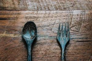 wood spoon on wooden table close up photo