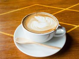 latte coffee on wood table photo