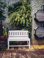 white chair in the garden for vintage style. photo