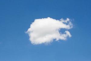 single cloud on blue sky background photo