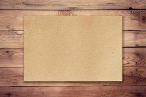 brown paper on wood background and texture photo