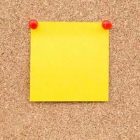 Sticky yellow blank note with space for text. photo