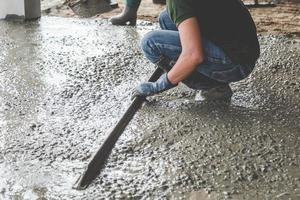 Mason building a screed coat cement photo