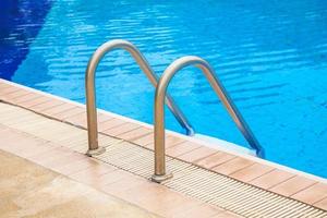 Swimming pool with stair at hotel. photo