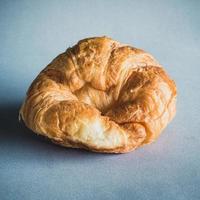 fresh croissants on gray background photo