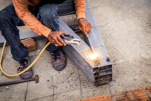 Close hand man arc welding or stick welding iron photo