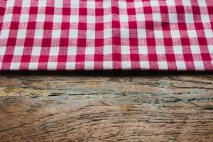 red fabric tablecloth textile on wooden background photo