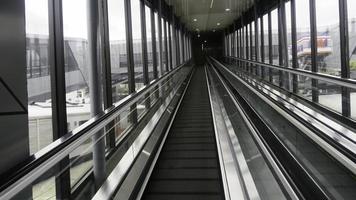 An escalator in one of the public places makes it easy to go up the building. photo