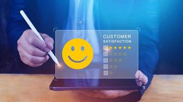 User gives rating to service experience on online application, Customer review satisfaction feedback survey concept, Customer can evaluate quality of service leading to reputation ranking of business. photo