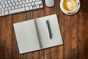 notepad, computer and coffee cup. View from above with copy space photo