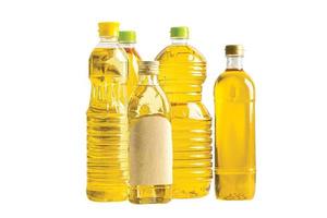 Vegetable oil with olive oil in different bottle for cooking isolated on white background. photo