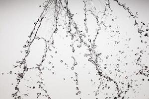 Falling water on a white background photo