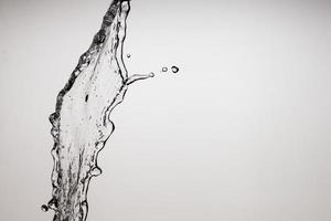 Falling water on a white background photo