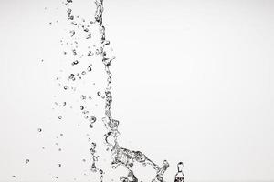 Falling water on a white background photo