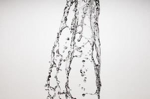 Falling water on a white background photo