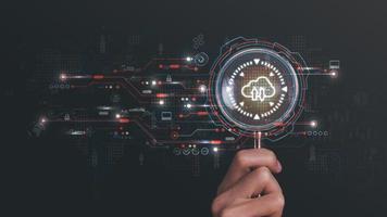man holding magnifying glass, Digital network data connection ,modern communication with information technology, innovative online backup with highly secured protection, cloud computing concept, photo
