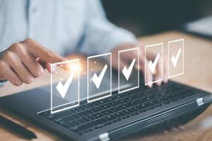 operator makes mark on the survey topic ,In virtual form check sheet, checklist ideas, checkbox to conduct opinion and quality surveys or satisfaction, Connect and work with modern wireless technology photo