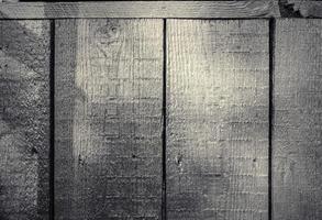 Wooden surface showing planks and grain textures in high resolution. photo