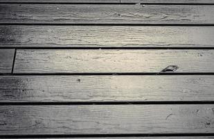 Wooden surface showing planks and grain textures in high resolution. photo