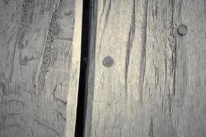 Wooden surface showing planks and grain textures in high resolution. photo