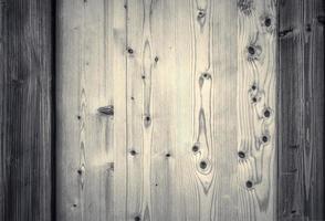 Wooden surface showing planks and grain textures in high resolution. photo